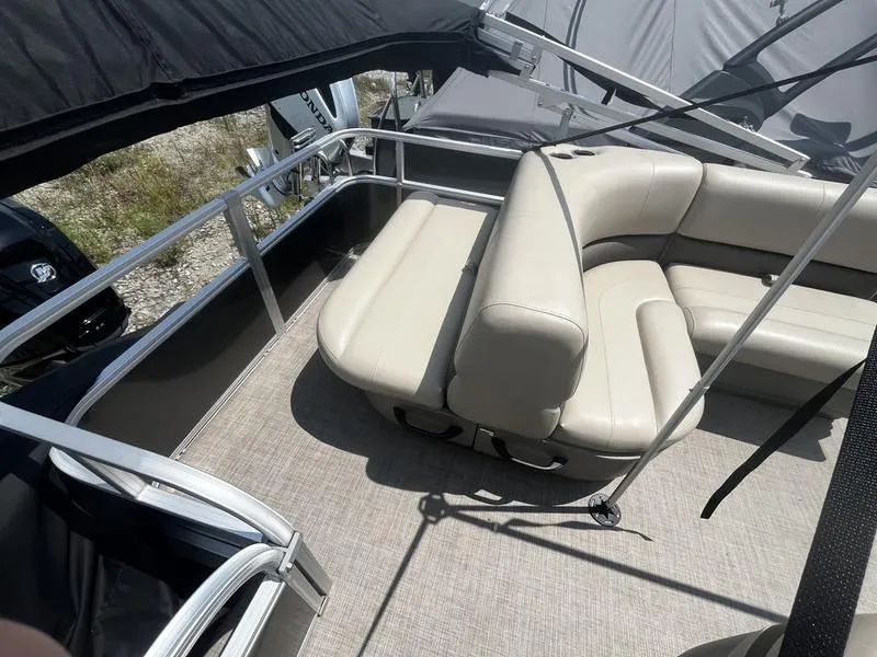 Slide: The Image of 2023 Sun Tracker Party Barge 18 interior with beige seating and railing. - 5
