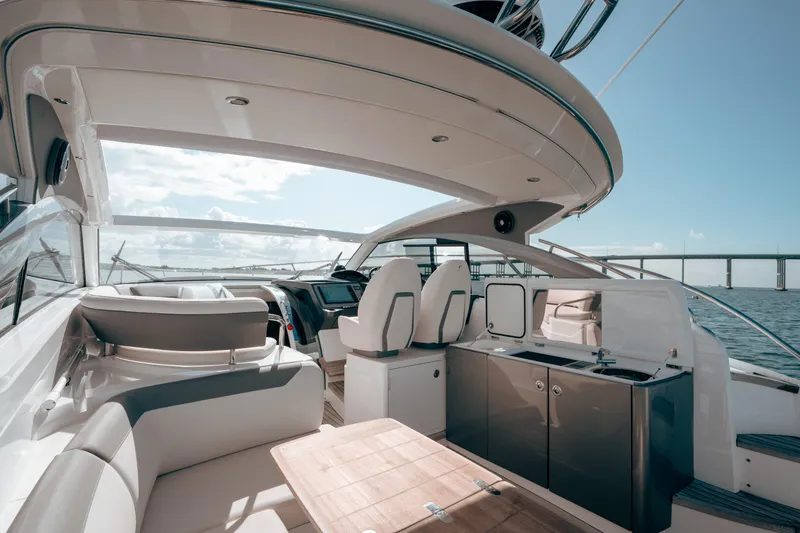Slide: The Image of Luxurious 2021 Princess V40 yacht interior with modern seating and ocean view. - 1