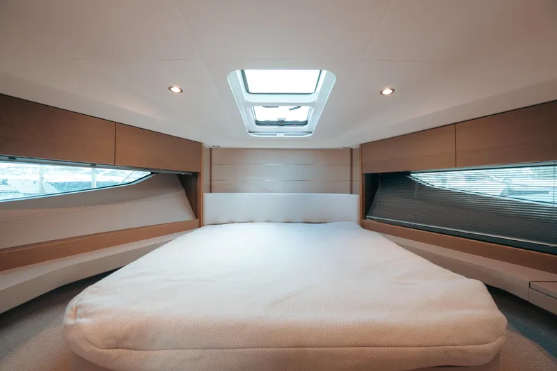 Slide: The Image of Luxurious cabin interior of 2021 Princess V40 yacht with skylight and modern design. - 12