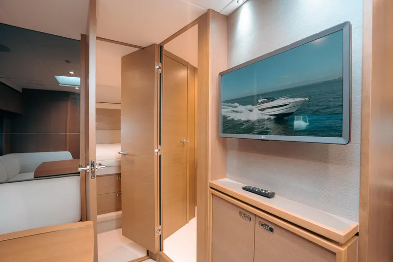 Slide: The Image of Luxurious interior of 2021 Princess V40 yacht with TV and wooden cabinetry. - 15