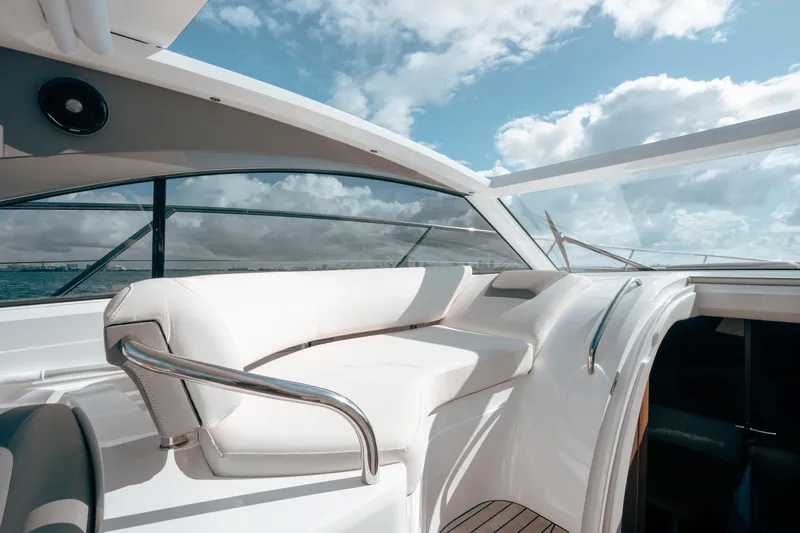 Slide: The Image of Luxurious 2021 Princess V40 yacht interior with white seating and ocean view. - 21