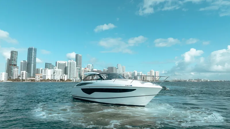 Slide: The Image of Princess V40 yacht cruising near city skyline, 2021 model. - 8