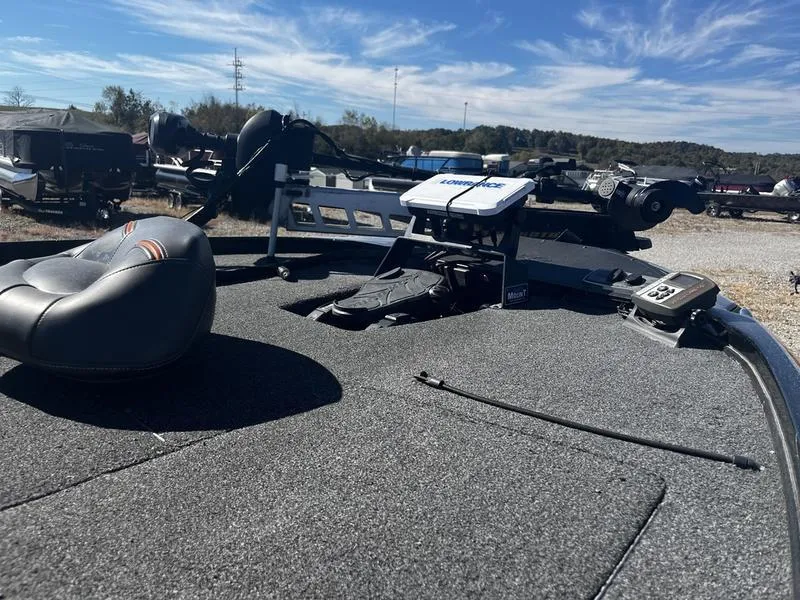Slide: The Image of 2019 Nitro Z18 boat deck with fishing equipment under clear blue sky. - 5