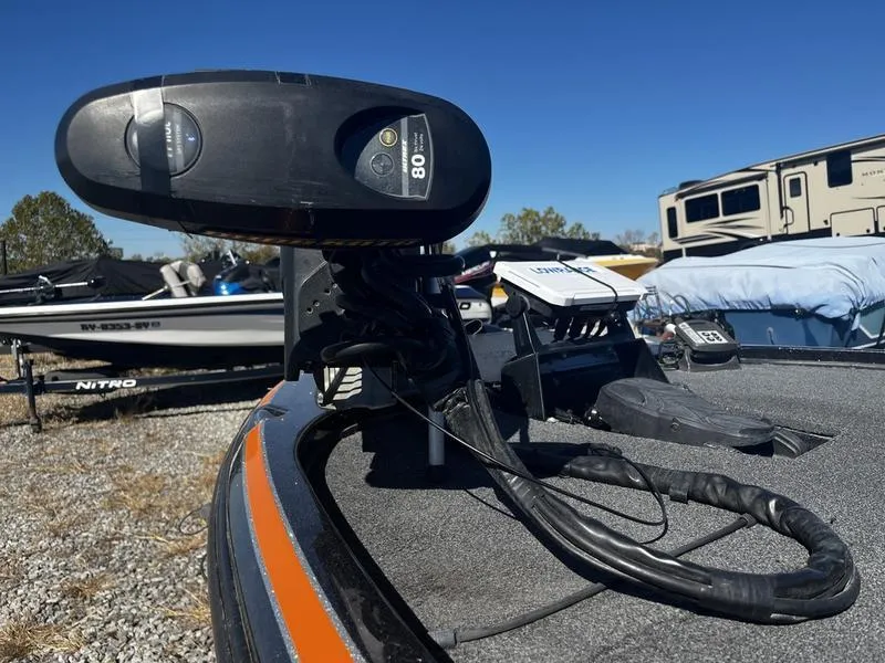 Slide: The Image of 2019 Nitro Z18 boat with trolling motor in outdoor storage area. - 7