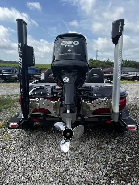 Slide: The Image of 2018 Nitro Z21 boat with powerful 250 HP Mercury engine, parked on gravel. - 4
