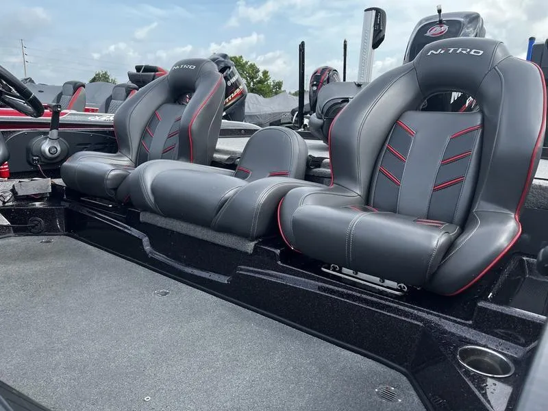 Slide: The Image of 2018 Nitro Z21 boat seats with sleek black and red design. - 5