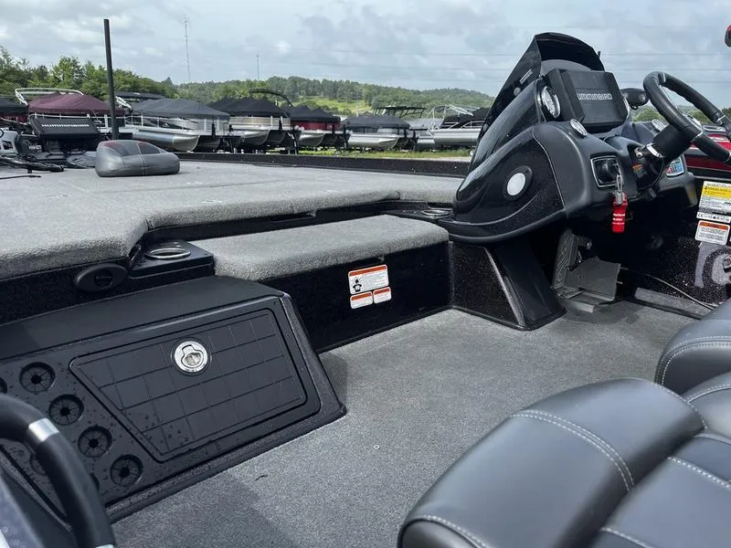 Slide: The Image of 2018 Nitro Z21 boat interior with steering wheel and seating. - 6