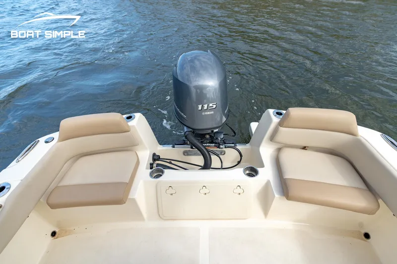 Slide: The Image of 2021 Scout 195 Sportfish boat with Yamaha 115 engine on calm water. - 9