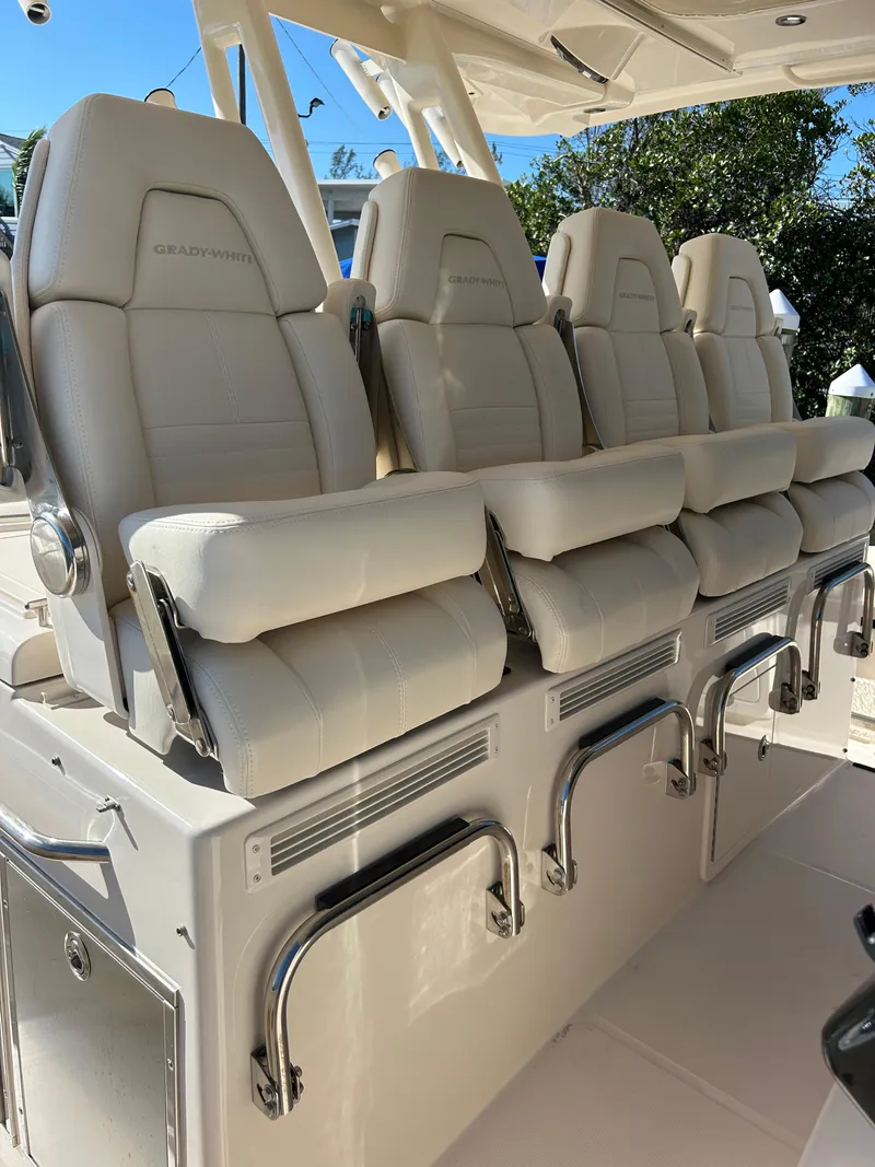 Slide: The Image of 2024 Grady-White Canyon 456 boat seats, luxurious white leather design. - 11