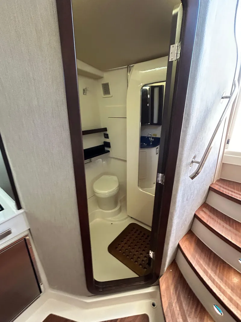 Slide: The Image of 2024 Grady-White Canyon 456 boat interior bathroom with modern amenities. - 14