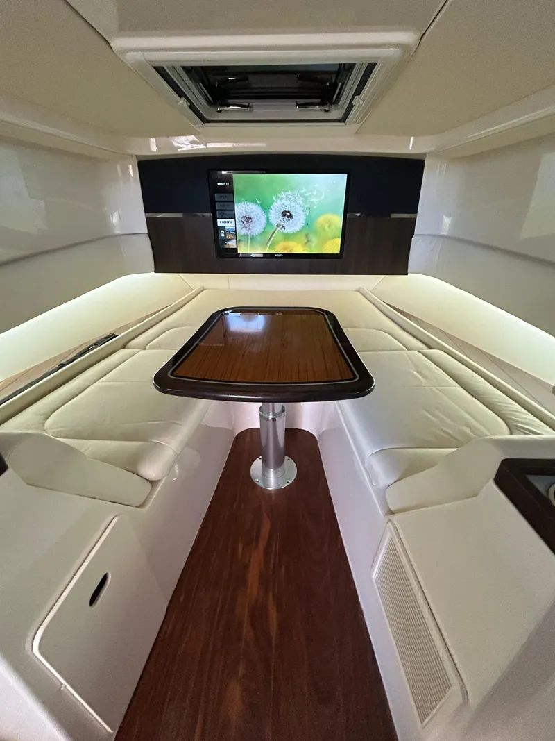 Slide: The Image of Luxurious interior of 2024 Grady-White Canyon 456 with plush seating and modern entertainment system. - 16