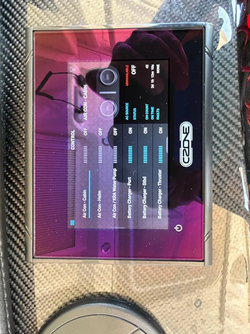 Slide: The Image of 2024 Grady-White Canyon 456 control panel with CZone system display. - 19