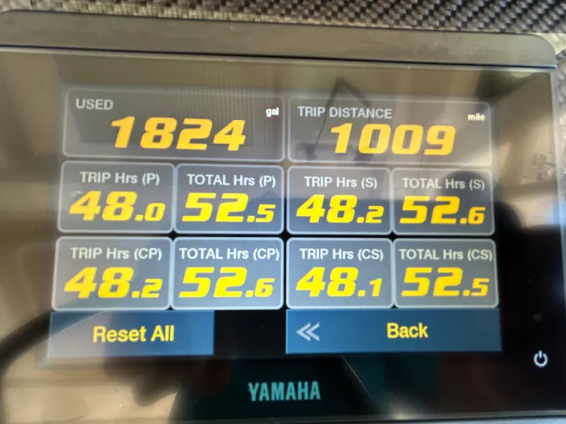 Slide: The Image of Dashboard display of 2024 Grady-White Canyon 456 showing fuel usage and trip data. - 22