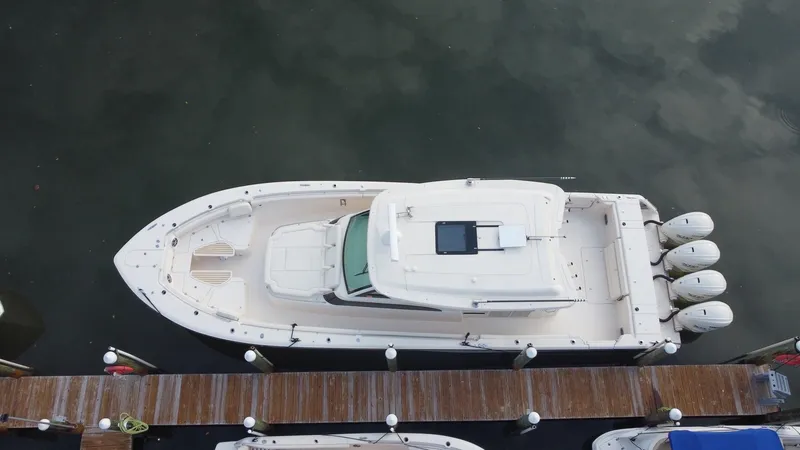 Slide: The Image of 2024 Grady-White Canyon 456 boat docked, aerial view. - 3