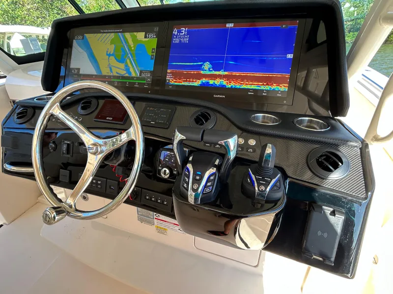 Slide: The Image of 2024 Grady-White Canyon 456 helm with advanced navigation displays and controls. - 4