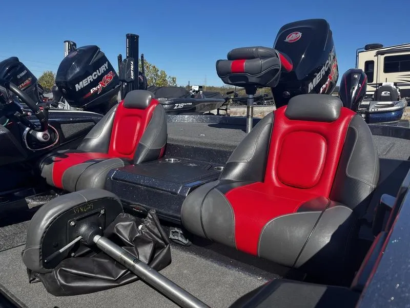 Slide: The Image of 2018 Ranger Z519 boat interior with red and gray seats, featuring Mercury engines. - 3