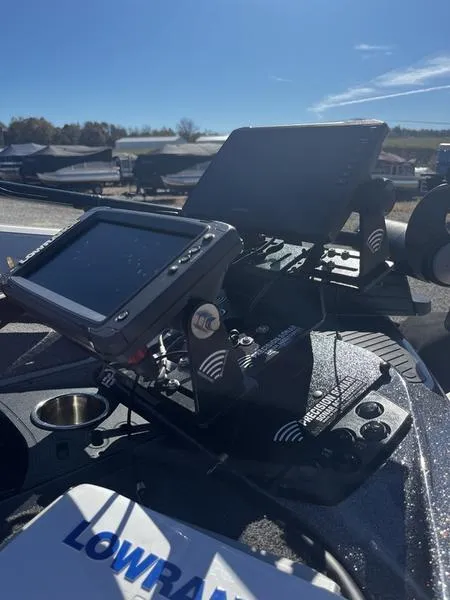 Slide: The Image of 2018 Ranger Z519 boat dashboard with Lowrance electronics under clear blue sky. - 7