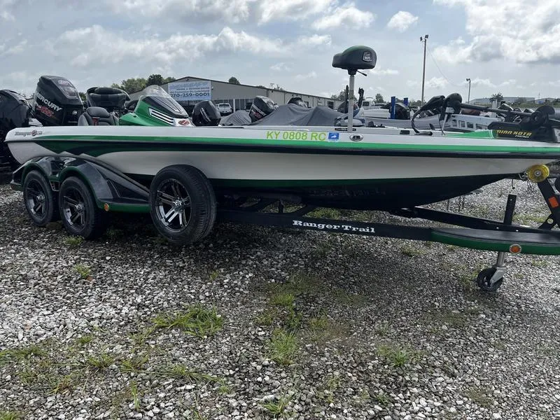 The Image of 2018 Ranger Z521C boat on trailer, parked on gravel lot under cloudy sky. - 1