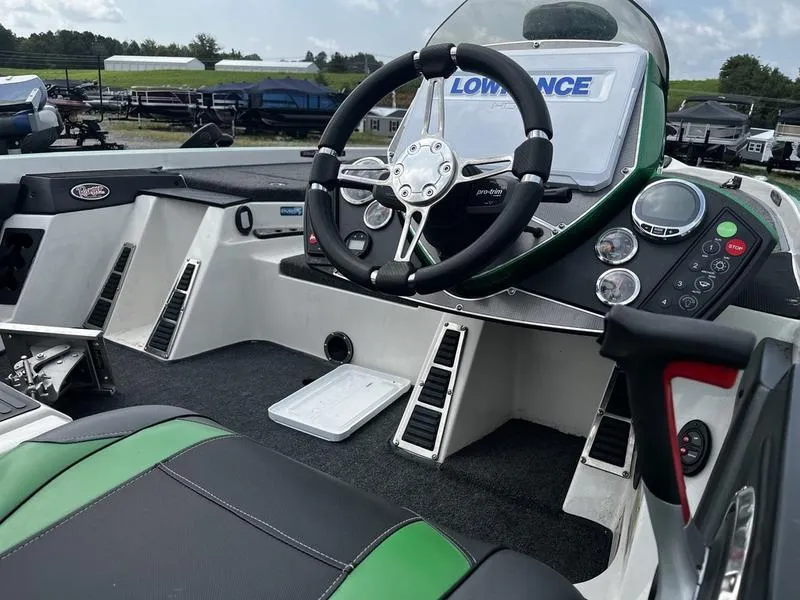 Slide: The Image of 2018 Ranger Z521C boat cockpit with steering wheel and control panel. - 5