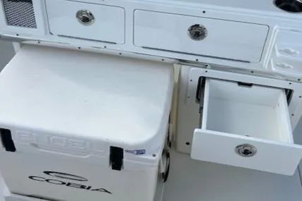 Slide: The Image of Cobia 265 Center Console Open 2025 with storage drawers and cooler. - 15