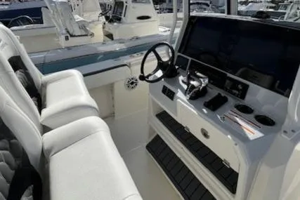 Slide: The Image of 2025 Cobia 265 Center Console Open boat interior with modern dashboard and seating. - 18