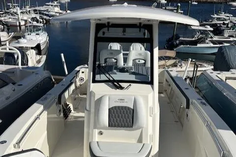 Slide: The Image of 2025 Cobia 265 Center Console Open boat docked at marina. - 26