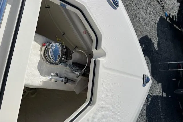 Slide: The Image of 2025 Cobia 265 Center Console Open boat storage compartment detail. - 27