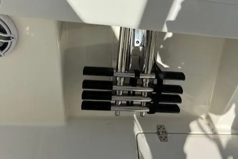 Slide: The Image of 2025 Cobia 265 Center Console Open boat rod holders and speaker detail. - 31