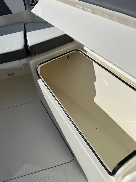 Slide: The Image of 2025 Cobia 265 Center Console Open storage compartment detail. - 33