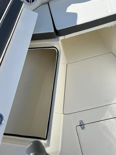 Slide: The Image of 2025 Cobia 265 Center Console Open boat interior storage compartment. - 34