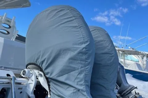 Slide: The Image of Covered outboard motors on a 2025 Cobia 265 Center Console Open boat. - 43