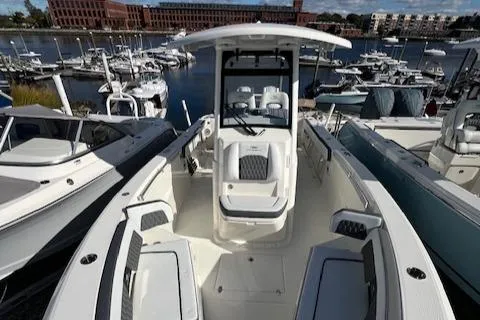 Slide: The Image of 2025 Cobia 265 Center Console Open boat docked in a marina. - 5