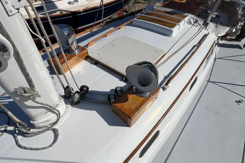 Slide: The Image of 1967 Hinckley Bermuda yacht deck with polished wood and metal fittings. - 10