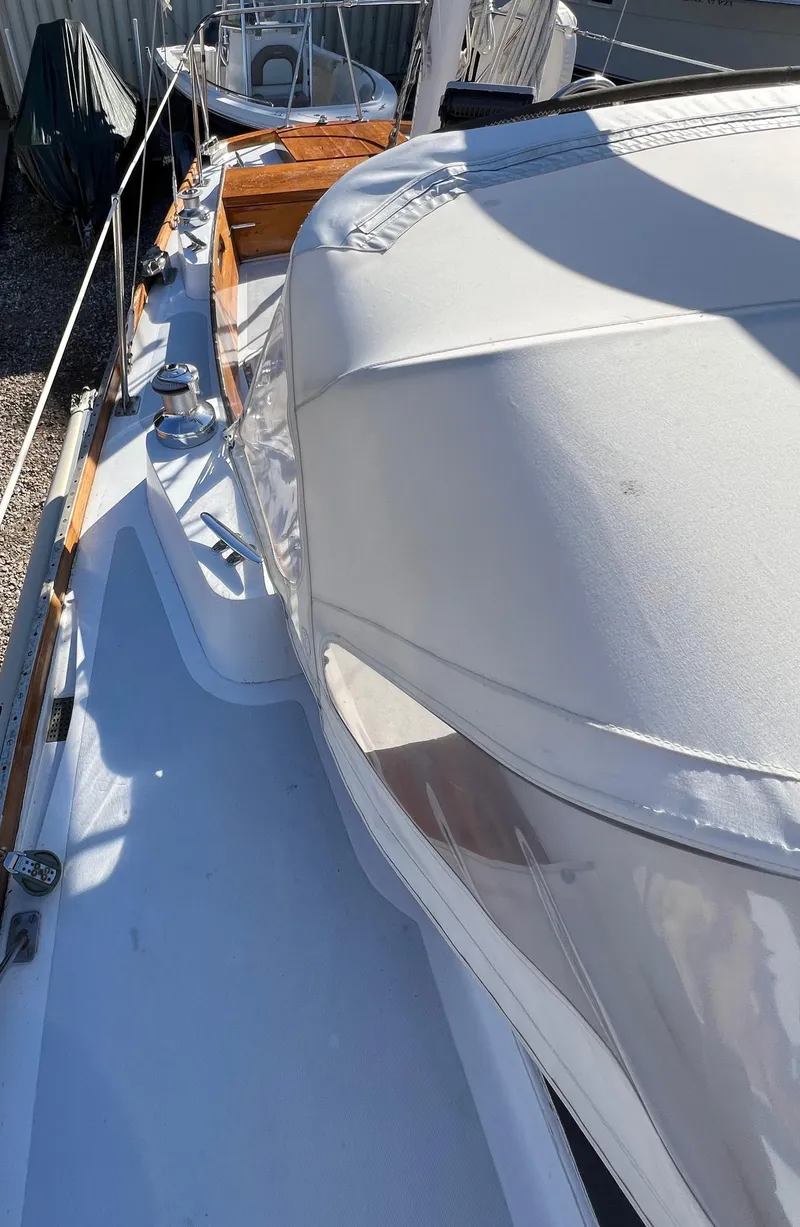 Slide: The Image of 1967 Hinckley Bermuda sailboat deck with sleek design and wooden accents. - 21