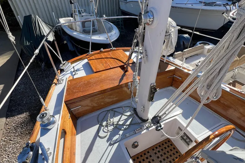 Slide: The Image of 1967 Hinckley Bermuda sailboat deck with wooden accents and rigging. - 24