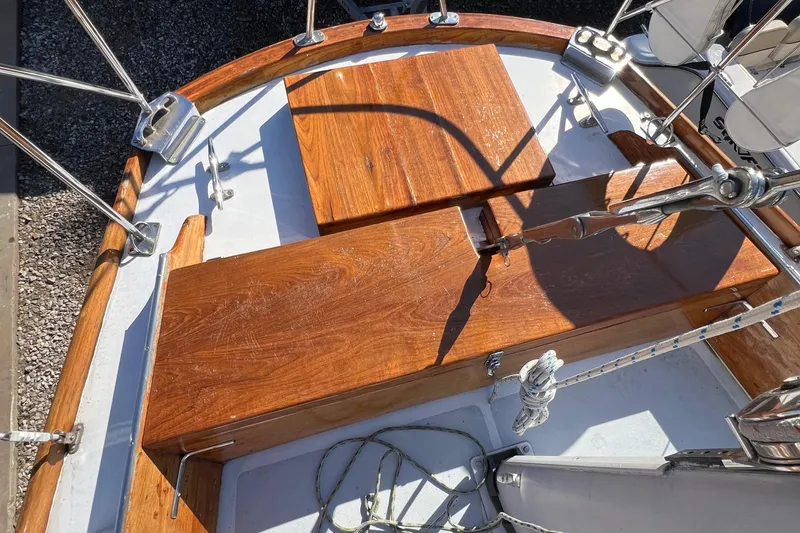 Slide: The Image of 1967 Hinckley Bermuda sailboat with polished wooden deck and metal railings. - 25