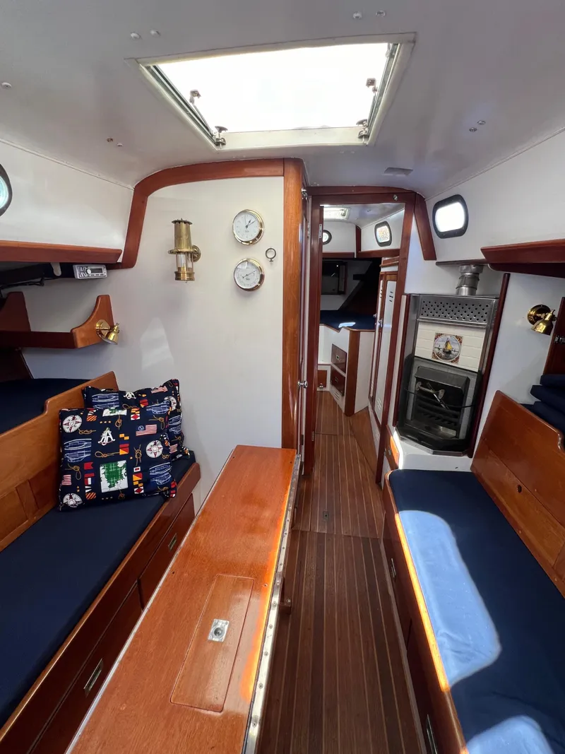 Slide: The Image of Interior of a 1967 Hinckley Bermuda sailboat with wood finishes and nautical decor. - 29