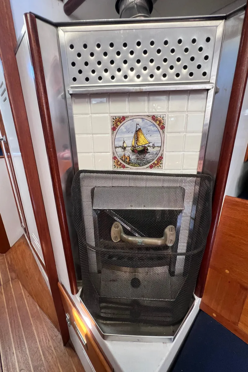 Slide: The Image of Vintage 1967 Hinckley Bermuda stove with nautical tile design. - 30