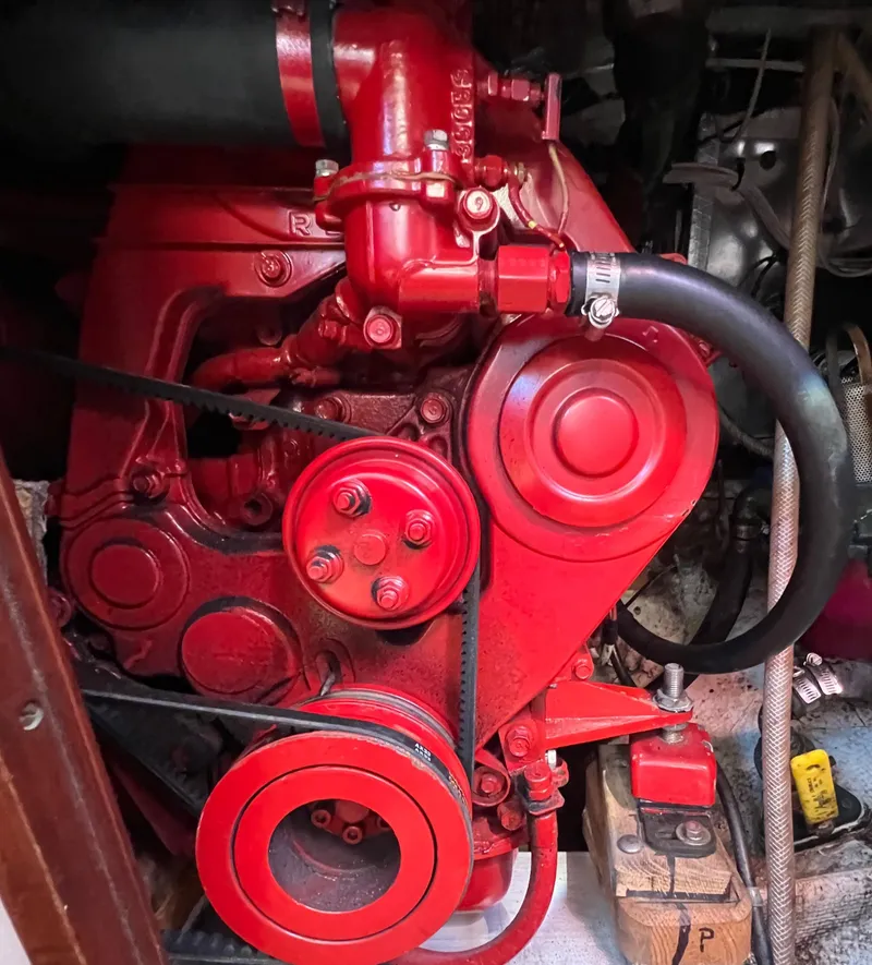 Slide: The Image of Red engine of a 1967 Hinckley Bermuda boat, detailed view. - 49