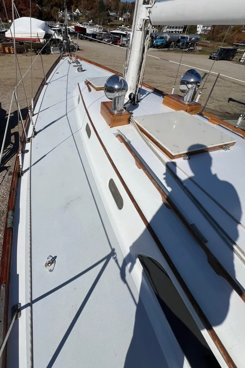 Slide: The Image of 1967 Hinckley Bermuda sailboat deck with shadow and polished fittings. - 7