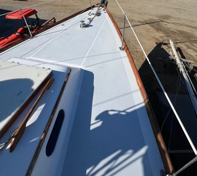 Slide: The Image of 1967 Hinckley Bermuda sailboat deck with wooden trim and rigging. - 9