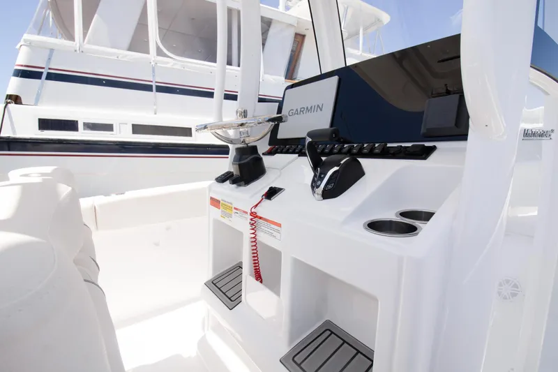 Slide: The Image of 2025 Sea Hunt Ultra 245 SE boat console with Garmin navigation system. - 4