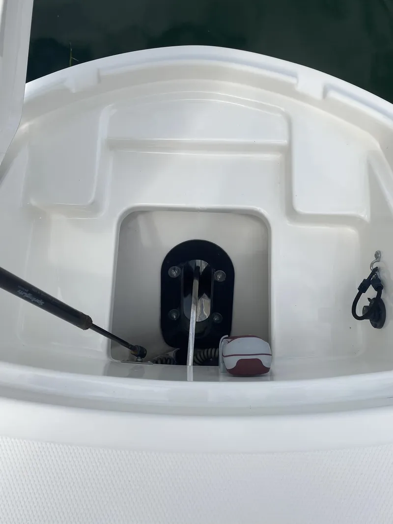 Slide: The Image of 2016 Sea Ray 350 SLX anchor compartment with clean, white interior. - 12