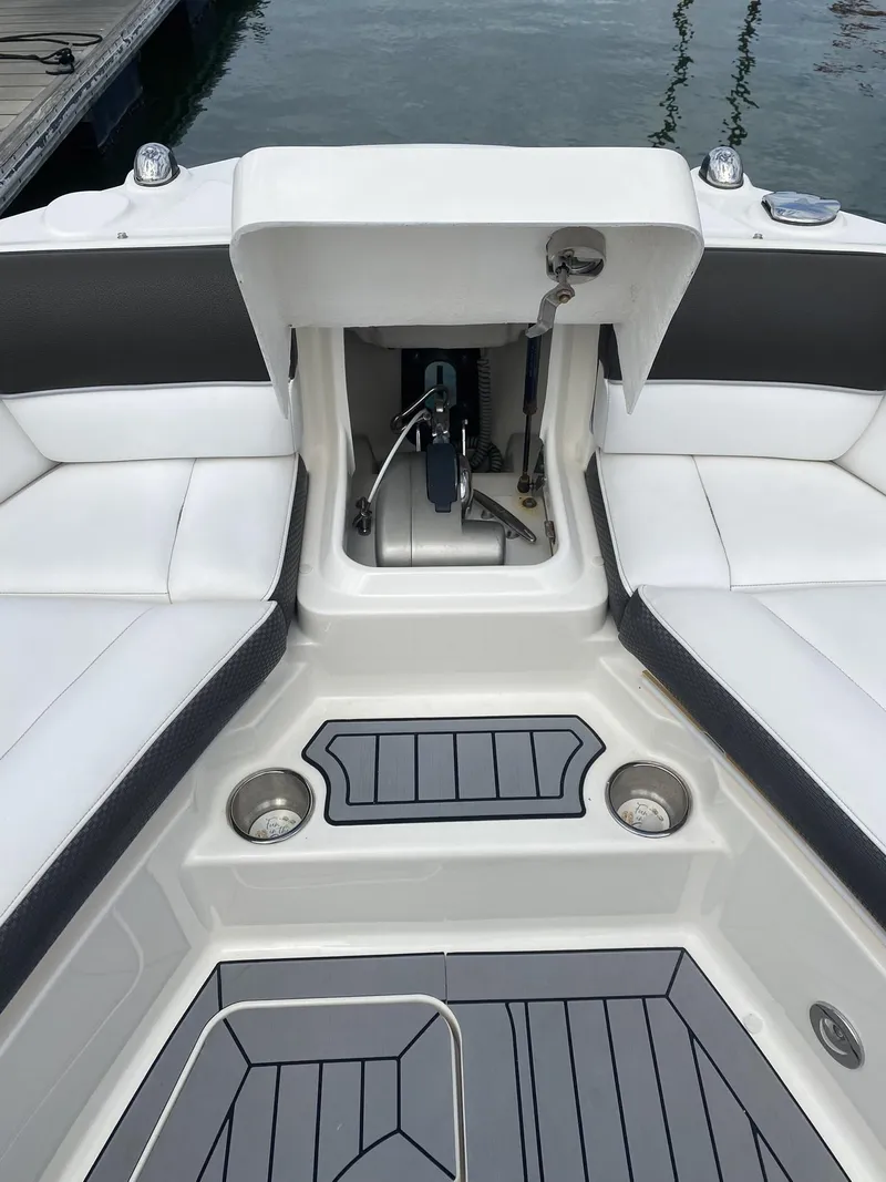 Slide: The Image of 2016 Sea Ray 350 SLX boat interior with open storage compartment. - 13