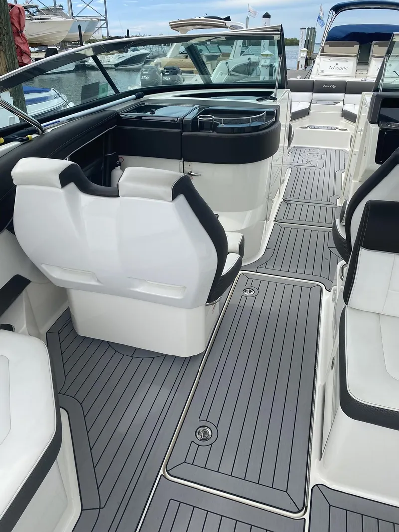 Slide: The Image of 2016 Sea Ray 350 SLX boat interior with sleek seating and modern design. - 24