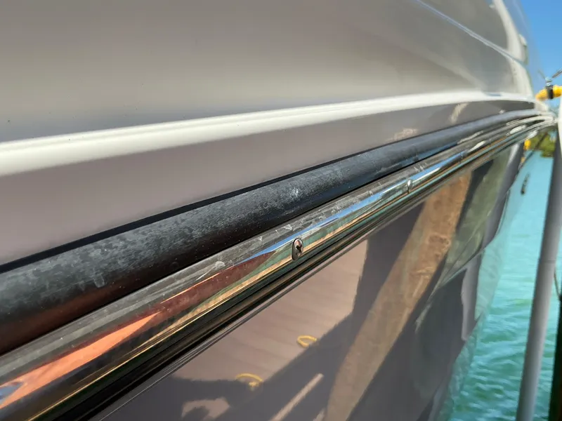 Slide: The Image of Close-up of 2016 Sea Ray 350 SLX boat hull and chrome detailing. - 26