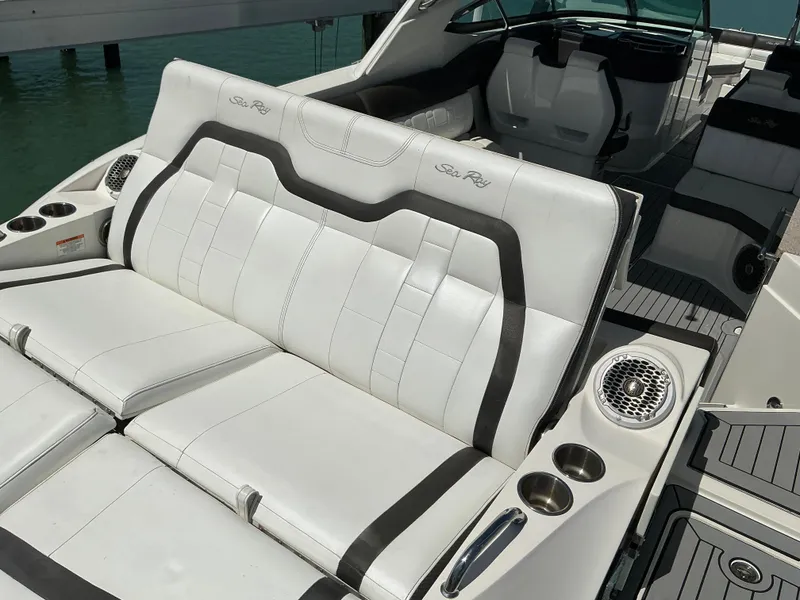 Slide: The Image of 2016 Sea Ray 350 SLX boat with luxurious white seating and cup holders. - 28
