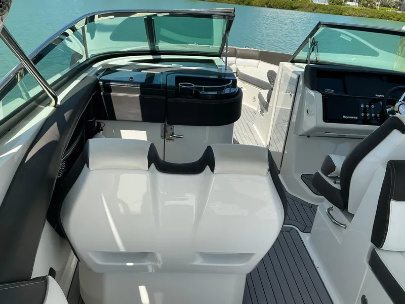 Slide: The Image of Interior view of a 2016 Sea Ray 350 SLX boat with sleek seating and control panel. - 31