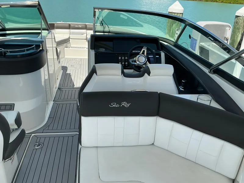 Slide: The Image of 2016 Sea Ray 350 SLX boat interior with sleek seating and modern dashboard. - 33