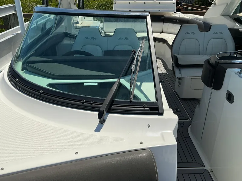 Slide: The Image of 2016 Sea Ray 350 SLX boat interior with seating and windshield view. - 40